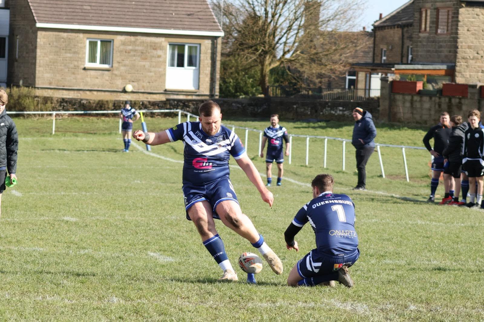 queensbury arlfc player kick in the goal after scoring a try in the cre8tive designed rugby kit