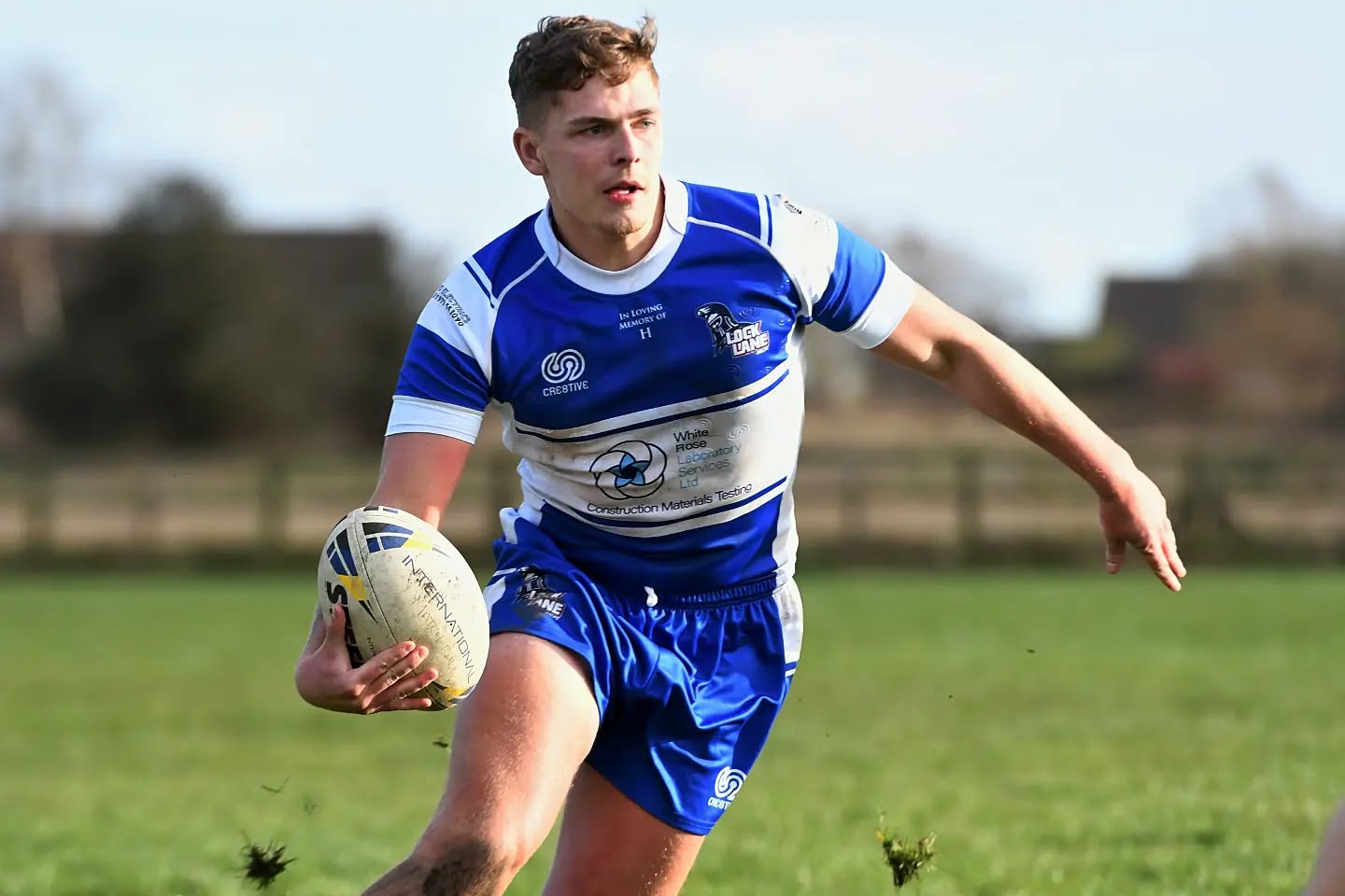 Lock Lane Rugby League Player wearing Club retro design home kit in royal blue and white by cre8tive teamwear