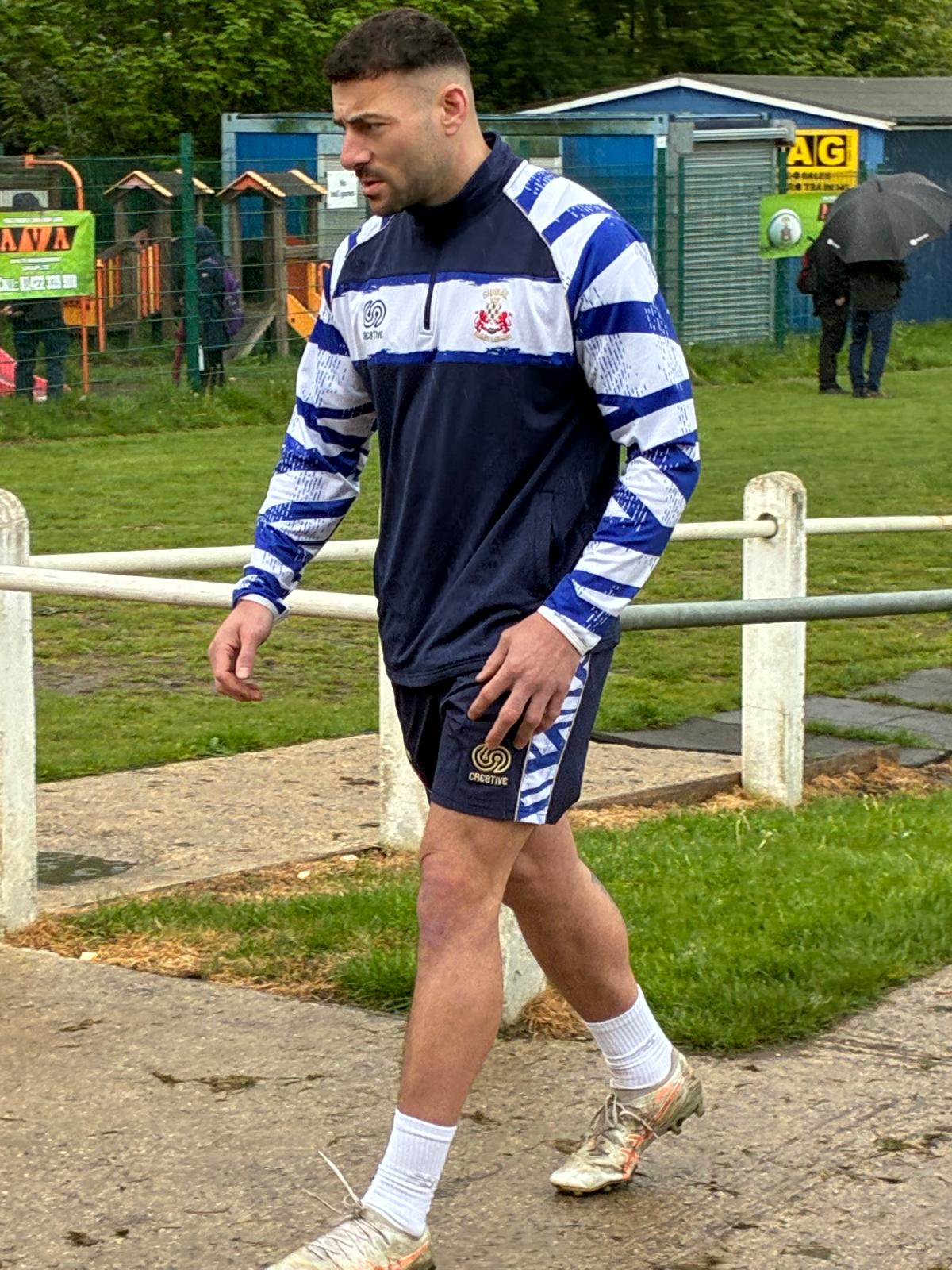 Custom rugby training wear designed by Cre8tive Teamwear and worn by Leeds Rhinos Player Jake Connor, featuring a part sublimated quarter-zip training top with embroidered logos and matching bespoke leisure shorts.